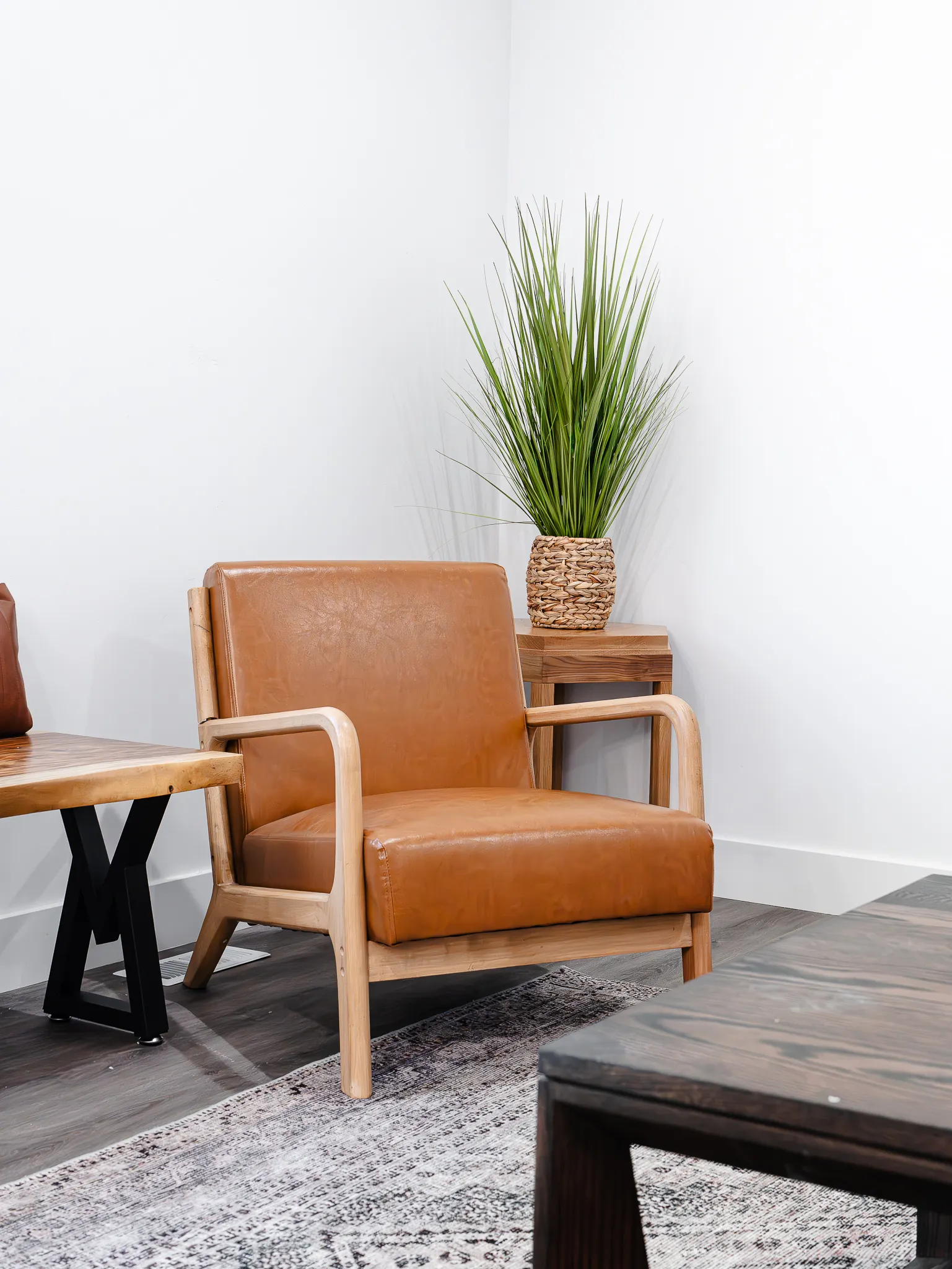 Staged sitting area with leather armchair and natural light